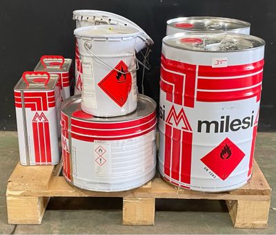 several cans of milk are stacked on a pallet on a pallet