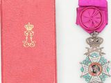 an image of a pink box with a medal and a pink ribbon