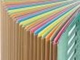 multicolored file folders stacked on top of each other