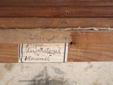 a picture of a piece of wood with a sign on it