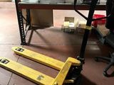 a forklift that is sitting on the floor in a warehouse