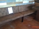 a picture of a corner bench in a small room
