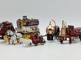 a lot of toy horses and carriages on a white surface