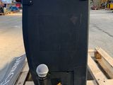 a microphone sitting on a pallet in a warehouse