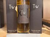 a bottle of wine that is on display on a shelf