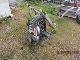 a machine that is sitting on the ground in the yard