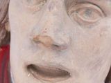 a statue of a man with a surprised look on his face