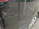 a car that has been painted black with a lot of scratches on it