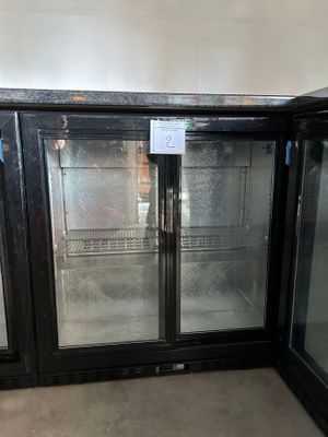 two glass doors that are open in a room