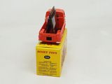 a red toy truck that is sitting on top of a box