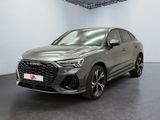 a grey 2021 audi qx parked in a showroom