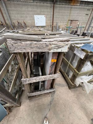 a pile of junk in a building with a broken door