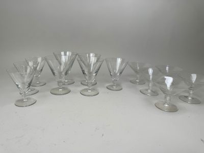 six wine glasses are lined up in a row on a table