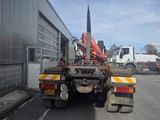 a truck that has a crane on the back of it
