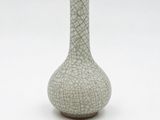 a white vase with a cracky design on it
