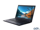 a laptop with a picture of a lake on the screen