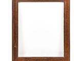 a wooden picture frame on a white background with a shadow