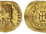 une pièce d'or à l'effigie d'une femme