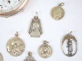 a lot of religious charms on a white surface