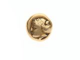 une pièce d'or représentant la tête d'un homme de profil