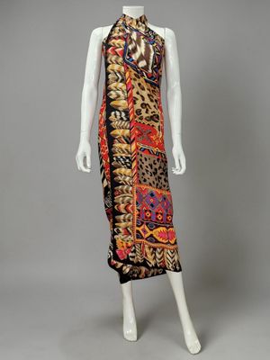 a mannequin dress with a multicolored print and black trim