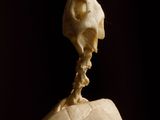a skull sitting on top of a ball on a table