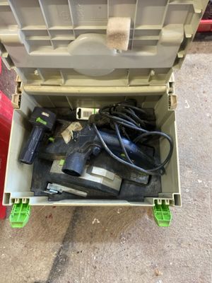 a tool box with tools in it sitting on the ground