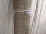 two rolls of fabric wrapped around each other on a bed