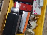 a yellow box filled with assorted items sitting on the floor