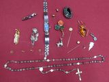 a lot of jewelry that is laying out on a table