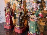 three figurines that are sitting on a table
