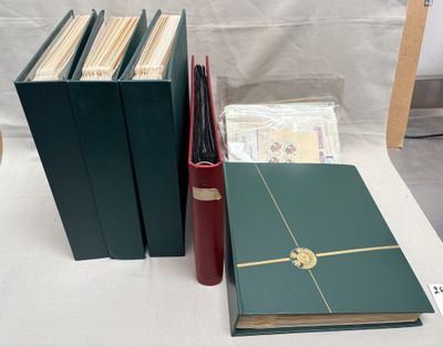 several books are lined up on a table with a white table cloth
