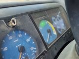 a dashboard with a speedometer, gauges, and a dash board