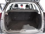 the back of a car with the trunk open and the seats down