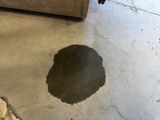 a dirty floor with a hole in the middle of it
