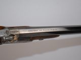 an old gun that is on display in a museum