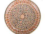 a plate with a design on it on a white background