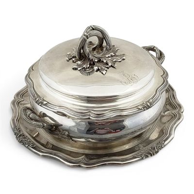 a silver plate with a silver lid on a white background