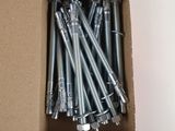 a box of nuts and bolts in it on a white surface