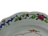 a plate with a floral design on it on a table