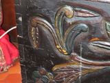 a wooden chest with a bird design on it