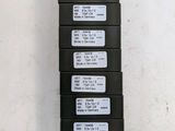 four stacks of black and white labels on a white wall