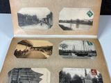an old photo of an open book with pictures on it