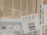 a package of toilet paper on the floor next to a toilet