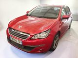the red car is parked in a white room with a white floor