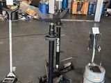 a picture of a garage with a lot of tools on the floor