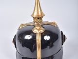 a black and gold helmet on a white background