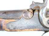 a close up of a gun that is on display