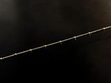 a close up of a metal object on a black surface