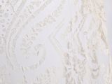 the back of a wedding dress with a lace pattern on it